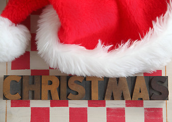 Image showing Christmas word with Santa Claus hat	