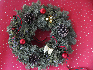 Image showing Christmas wreath on red and white polka dots	