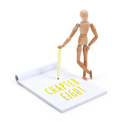 Image showing Wooden mannequin writing - Chapter eight