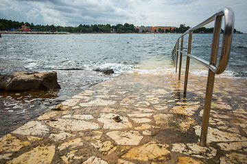 Image showing metal rail for descent to water