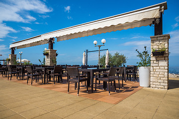 Image showing modern wicker furniture in street restaurant 