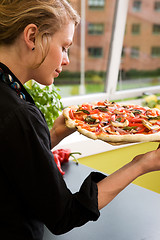 Image showing Young Woman with Fresh Pizza