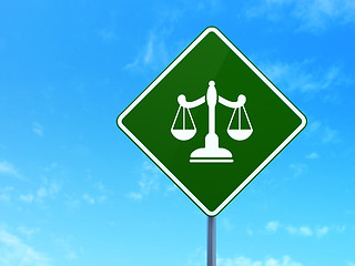 Image showing Law concept: Scales on road sign background