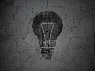 Image showing Finance concept: Light Bulb on grunge wall background