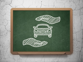 Image showing Insurance concept: Car And Palm on chalkboard background