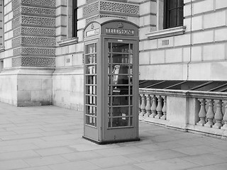 Image showing Black and white Red phone box in London