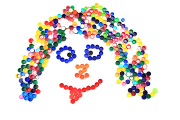 Image showing color plastic caps as human face 