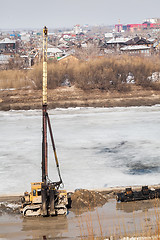 Image showing Pile driving machine in construction site. Tyumen