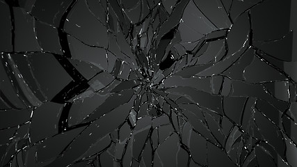 Image showing Splitted or cracked glass on black