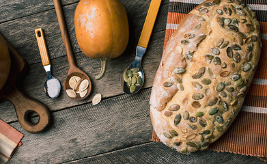 Image showing Rustic style pumpkins and bakery with seeds on cloth