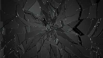 Image showing Pieces of cracked glass on black background