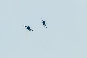 Image showing Two fighter SU-27 put bend