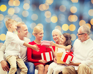 Image showing smiling family with gifts