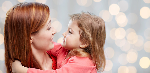 Image showing happy mother and little daughter hugging