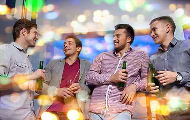 Image showing group of male friends with beer in nightclub