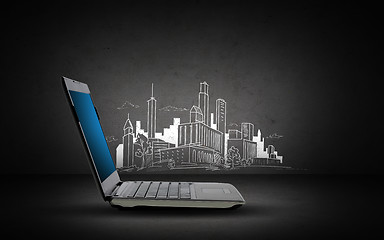 Image showing laptop computer with blank screen and city sketch