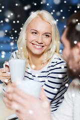 Image showing happy couple meeting and drinking tea or coffee