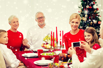 Image showing smiling family having holiday dinner at home