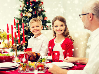 Image showing smiling family having holiday dinner at home