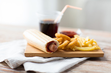 Image showing close up of fast food snacks and drink on table