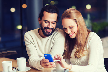 Image showing happy couple with tablet pc and coffee at cafe