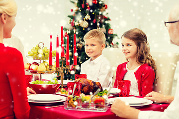 Image showing smiling family having holiday dinner at home