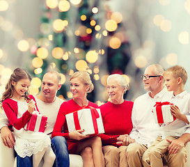 Image showing smiling family with gifts