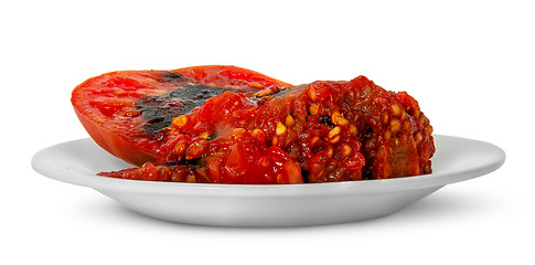 Image showing Rotting tomato on white plate