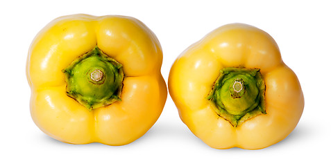 Image showing Two yellow bell peppers lying beside