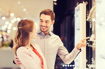 Image showing couple looking to shopping window at jewelry store