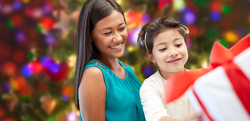 Image showing happy mother and child with gift box