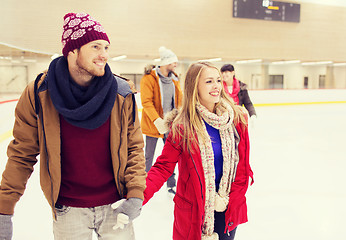 Image showing happy friends on skating rink