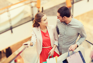 Image showing happy young couple with shopping bags in mall