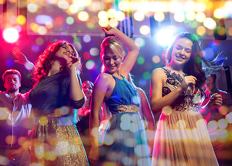 Image showing smiling friends dancing in club