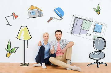 Image showing happy couple showing thumbs up at new home