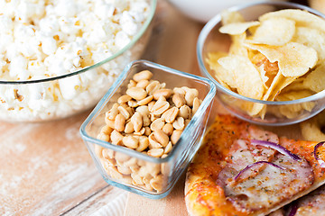 Image showing close up of fast food snacks on wooden table