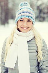 Image showing smiling young woman in winter forest