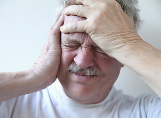 Image showing senior man with terrible headache 