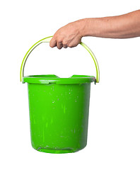 Image showing Human hand holding empty plastic pail