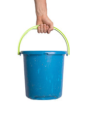 Image showing Human hand holding empty plastic pail