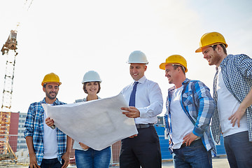 Image showing group of builders and architects with blueprint