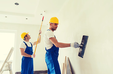 Image showing group of builders with tools indoors