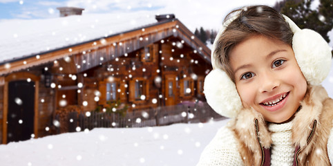 Image showing happy little girl wearing earmuffs