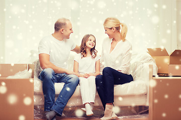 Image showing smiling parents and little girl at new home