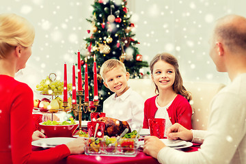 Image showing smiling family having holiday dinner at home