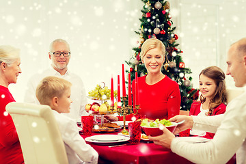 Image showing smiling family having holiday dinner at home