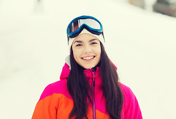 Image showing happy young woman in ski goggles outdoors