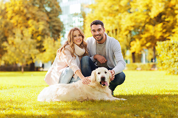 Image showing happy couple with labrador dog autumn in park