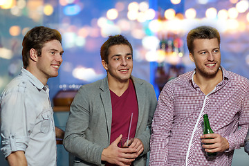 Image showing group of male friends with beer in nightclub