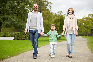 Image showing happy family walking in summer park